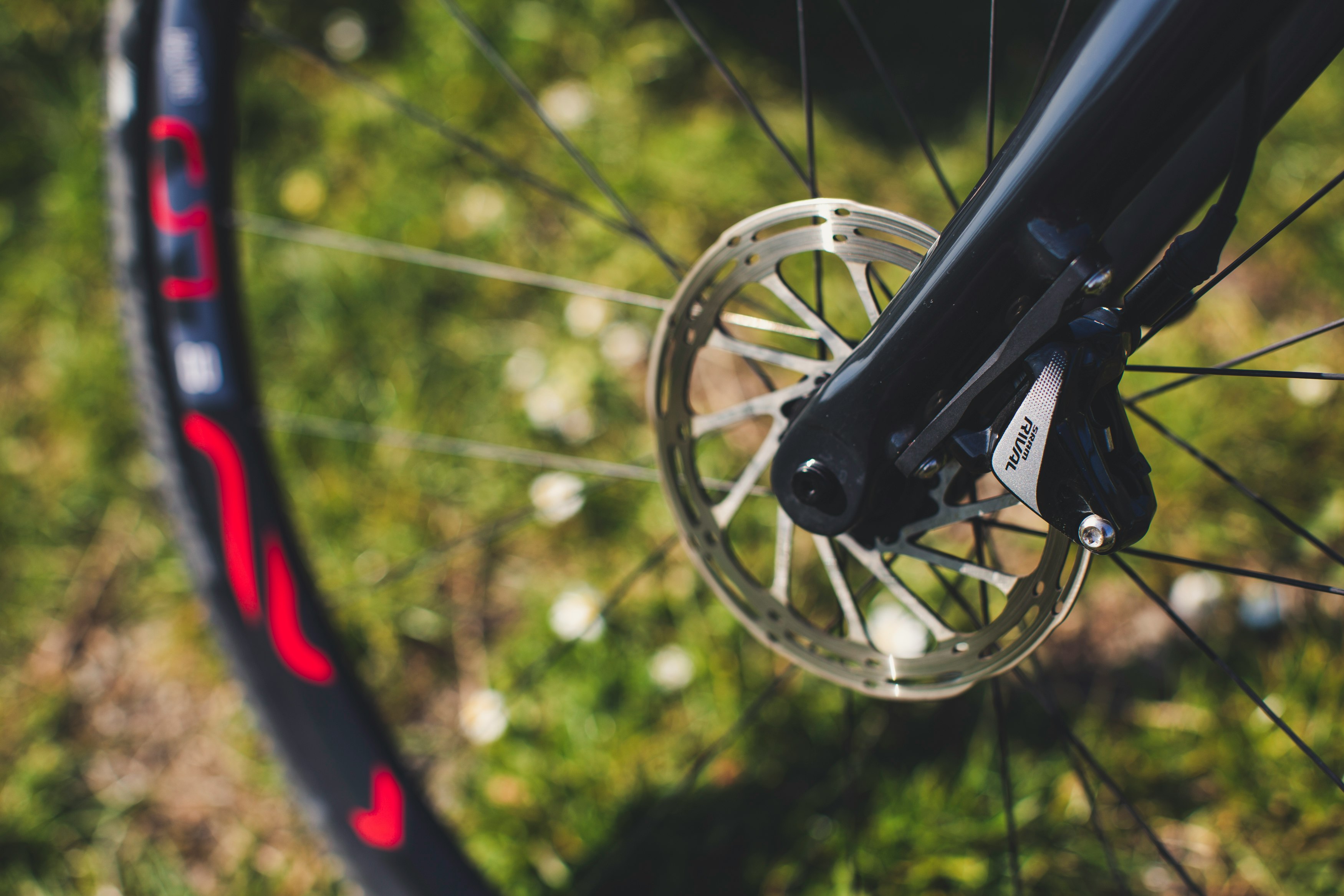 black bicycle wheel in tilt shift lens